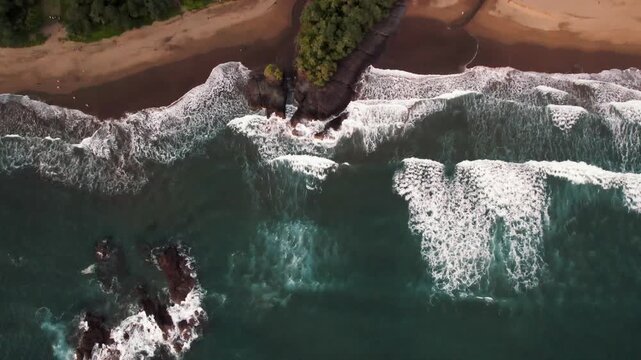 Aerial view of twin channels meeting the sea on Java south coast
