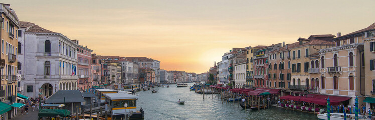 Venice Grand Canal with gondola and water taxi in sunset © Sergey