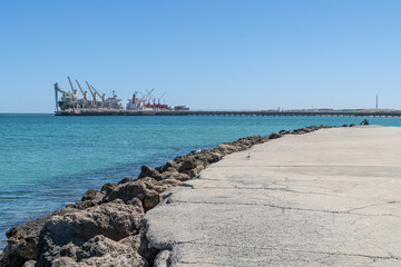 The Kwinana Jetty with grain ships loading at the Kwinana Bulk Jetty in the distance, Rockingham, Western Australia, Australia