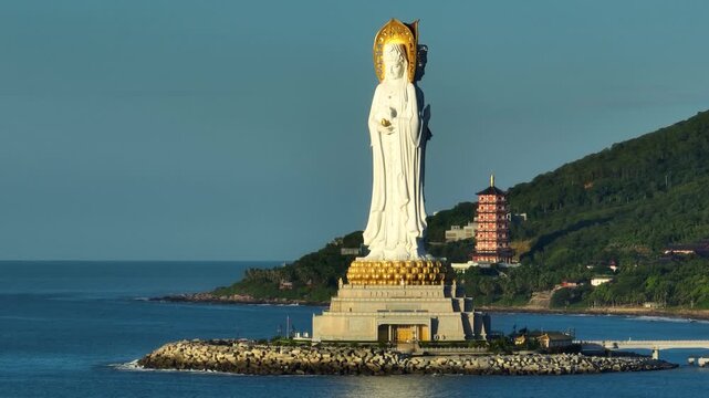 Buddhism Guanyin statue at seaside in nanshan temple, hainan island , China, words mean blessing and mercy