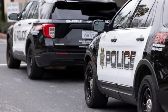 San Jose, California, USA - February 2, 2026: San Jose Sate University police cruisers park outside of the Police Department headquarters.