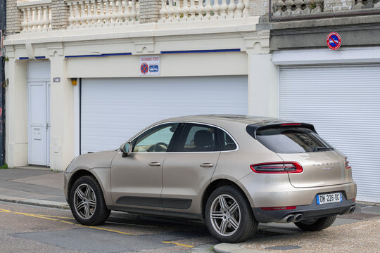 Le Havre, France - August 13th 2021 : View on a beige Porsche Macan S parked on a street.