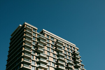Modern residential tower with repeating balconies and clean geometric facade. Contemporary high rise housing building in Belgrade. © Ekaterina