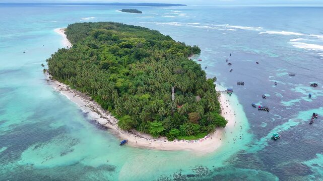 Aerial drone orbit around the pristine tropical island of Cayo Zapatilla surrounded by turquoise Caribbean water in Bocas del Toro Panama.