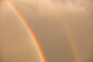 Fototapeta premium Vibrant Vertical Rainbow at Golden Hour