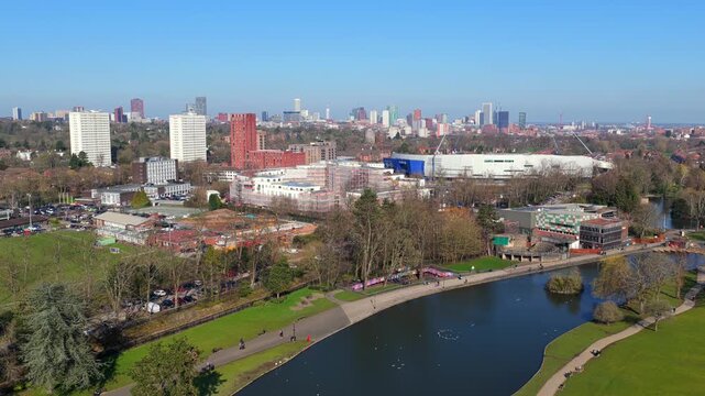 Aerial video of Cannon Hill Park boating lake and Birmingham skyline.