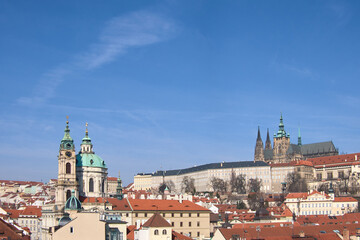 Fototapeta premium Prague Castle skyline dominated by St Vitus Cathedral above red clay roofs