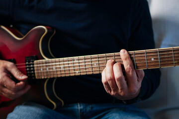 Fototapeta premium Musician playing electric guitar creating music