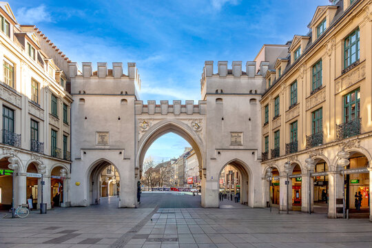 people enter the inner city by passing the Karlstor, a former medieval city gate.