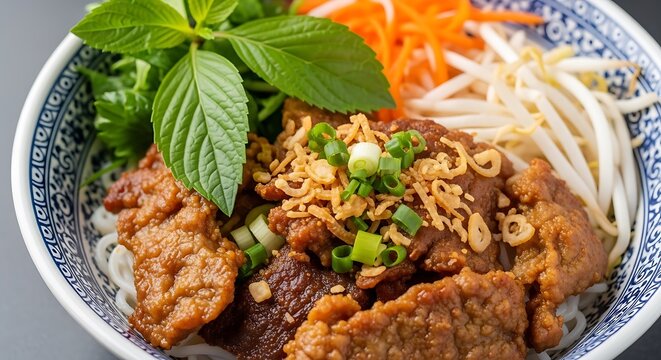 Delicious Vietnamese Bun Thit Nuong noodle bowl with fresh herbs and crispy toppings