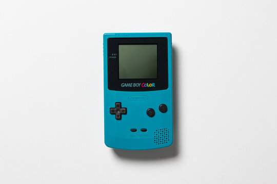 Nintendo Game Boy Color. The handheld console is teal and on a white background.