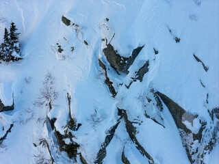 Aerial View of Snow-Covered Rocky Mountain Slope in Winter, BC, Canada © edb3_16