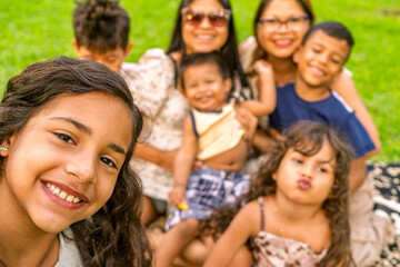 Fototapeta premium Multigenerational family group enjoying time together outdoors