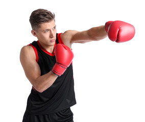 Athletic man in red boxing gloves fighting on white background