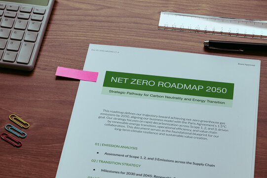 Environmental concept of Net Zero Roadmap 2050 on mock with ruler, calculator, clips. Sustainable development and ecology focused imagery.