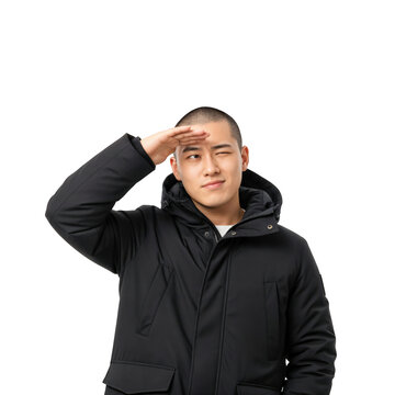 Young Asian Man in Black Winter Parka Shielding Eyes from Sun on transparent background