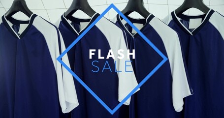 Hanging row of navy-blue white athletic jerseys on rail with black hangers, FLASH SALE overlay