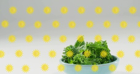 Displaying light blue bowl holding kale leaves at pale studio table, sunburst grid, copy space