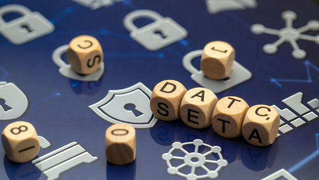 Wooden blocks spelling "DATA SEC" are surrounded by security symbols.