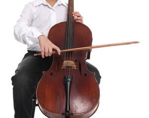 Fototapeta premium Little boy playing violoncello on chair against white background, closeup