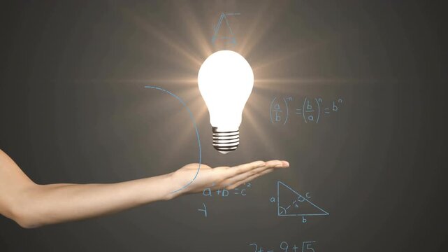 Bare forearm catching descending bulb, causing bulb glowing while chalkboard filling with math
