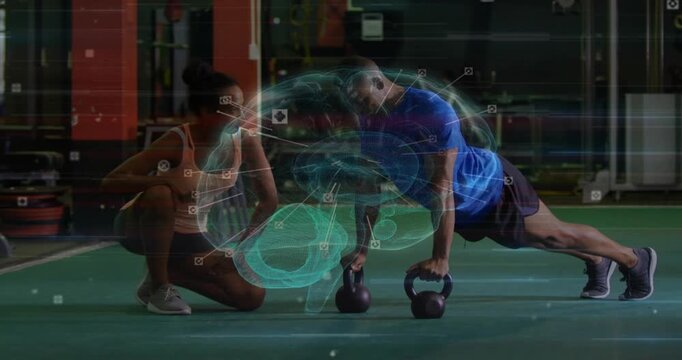 Female coach cueing male trainee doing kettlebell push-ups on turf, holographic brain tracking form