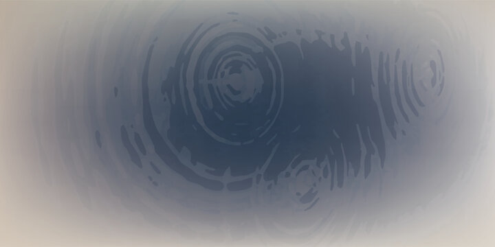 Water ripples creating concentric circles on a dark surface.