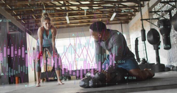 Coach kneeling, adjusting dummy and instructing athlete for boxing while chart overlaying subjects