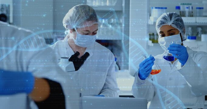 Holding orange blue flasks researchers inspecting liquids at bench masked gloved microscope laptop