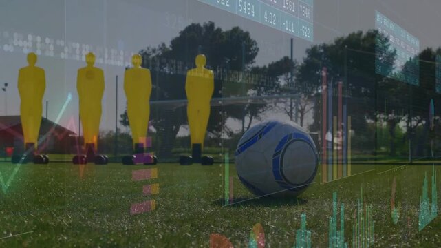 Kicker planting foot and launching shot during soccer training, overlays tracking ball and dummies