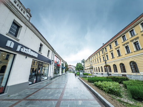 VALJEVO, SERBIA - MAY 18, 2025: Empty Kneza Milosa pedestrian street in Valjevo, Serbia, lined with shops and historic buildings, a quiet city center reflecting local retail and Serbian urban economy.