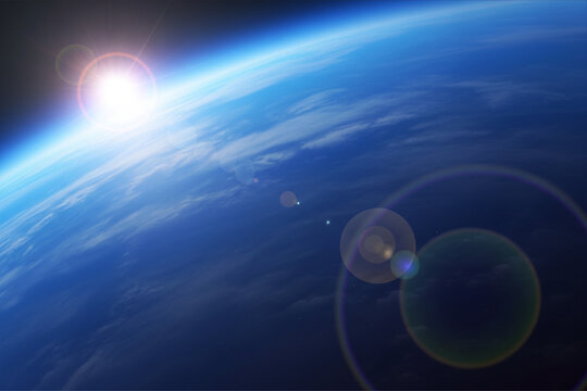 Bright lens flare enhances the vibrant blue sky 