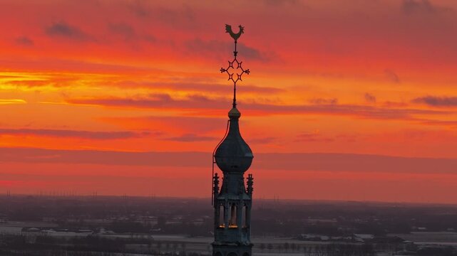 Aerial winter sunrise over Doesburg with white landscapes and warm light spreading across the historic town.