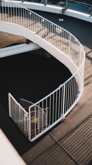 Fototapeta premium narrowing. Aerial view of a spiral staircase structure narrowing towards the top in minimalist concrete architecture. real-estate listings. 