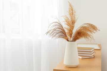 Interior of living room with commode , home decor and modern curtains hanging on big window © Pixel-Shot