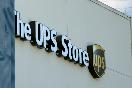 The UPS Store Exterior Sign On Commercial Building Wall