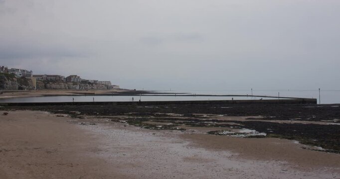 Wide shot of walpole tidal pool at low tide. At Margate.