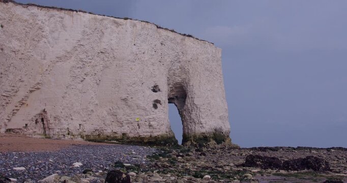 wide shot looking north on Kingsgate bay of Kingsgate Arch and cliffs