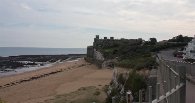 Extra wide panning shot looking across kingsgate Bay with kingsgate castle in background