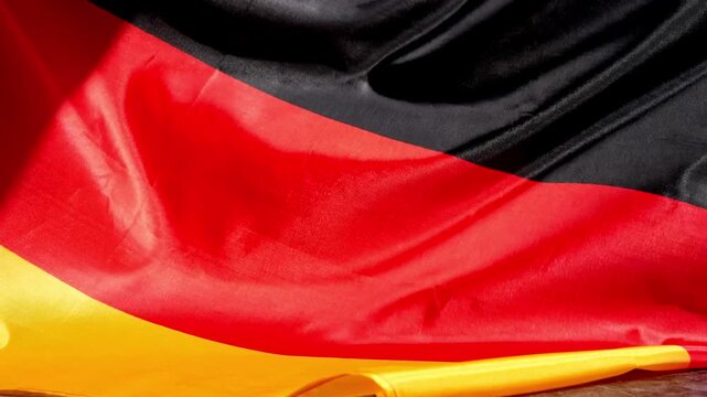 National symbol of Germany. German full framed wave Germany fabric flag background. Copy space for your text. Concept of Independence
