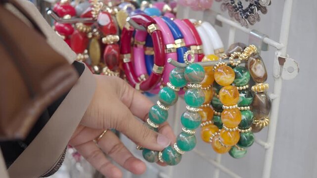 Shopping for colorful bracelets at a local market