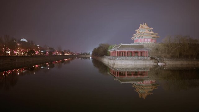 The Illuminated Corner Tower of the Forbidden City and Moat with Reflections at Night, Spring Festival, Beijing