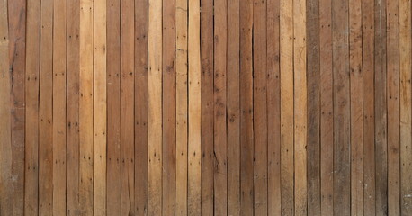 High-resolution background of vertical wooden planks shows diverse grain patterns and natural brown tones for a rustic aesthetic