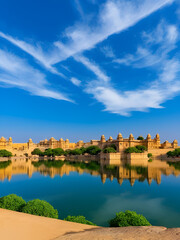 Fototapeta premium Indian Landmark Gadi Sagar Artificial Lake. Jaisalmer, Rajasthan, India Panorama Of The Udaipur City Palace Complex From Lake Pichola In Rajasthan, India Ruined Architecture At Gadisar Lake, Jaisalm