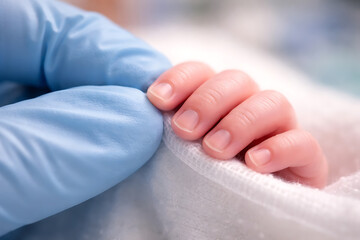 Close-Up of Newborn Baby Hand Holding Finger of Healthcare Worker in Neonatal Care