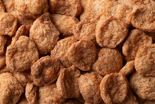 Texture of raw textured vegetable protein (TVP) soy meat chunks, Food background