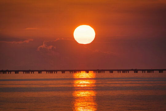 Lake Pontchartrain Causeway twin span bridges seen at sunset from Mandeville, Louisiana