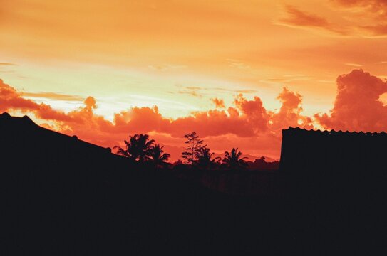 Dramatic Orange Sunset Sky with Glowing Clouds on the Horizon