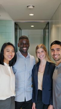 Portrait of young multiethnic staff, HR team in a modern office hallway, vertical footage