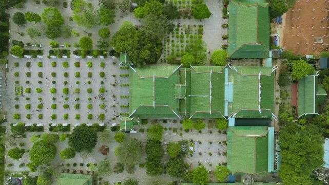 Top-Down Bird's Eye View of Traditional Green Pagoda Roofs in Vietnam
the green-tiled roofs of Linh Ung Pagoda and Thap Xa Loi. This shot highlights the geometric symmetry